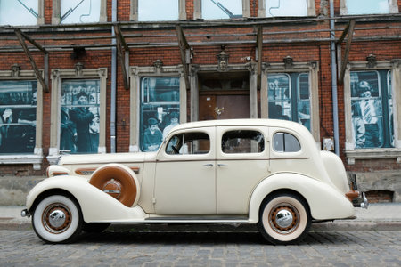 GDANSK, POLAND - 7 September 2019: Event in Lower Town of Gdansk "Classics for retro" presenting vintage cars. Buick Roadmaster on the street and background with houses with old photos in windows.のeditorial素材