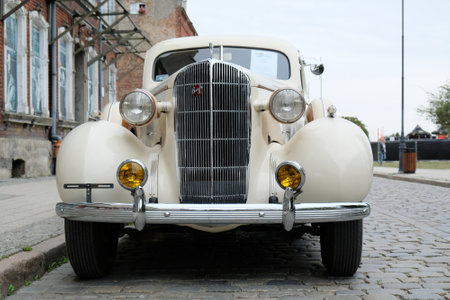 GDANSK, POLAND - 7 September 2019: Event in Lower Town of Gdansk "Classics for retro" presenting vintage cars. Buick Roadmaster on the street and background with houses with old photos in windows.のeditorial素材