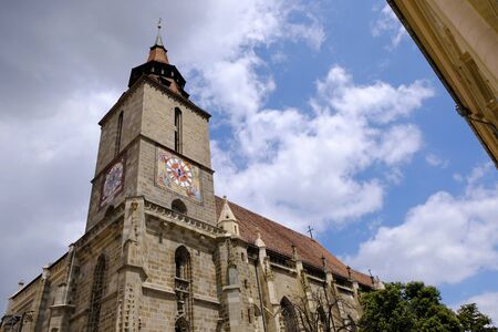 Romania, Transylvania - the tower of the black gothic church in Brasov. Brasov is charming town located at the foot of the Carpathians.の写真素材