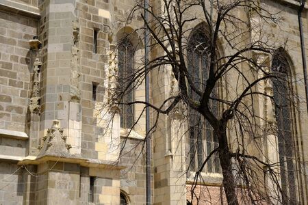 Romania, Transylvania - the black gothic church in Brasov. Brasov is charming town located at the foot of the Carpathians.の写真素材