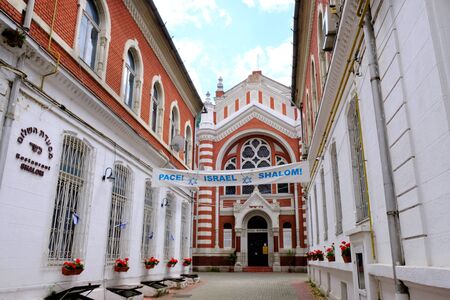 BRASOV, TRANSYLVANIA, ROMANIA - around July 2018: Synagogue in the historic center of the city. Brasov is charming antique town located at the foot of the Carpathians.の写真素材
