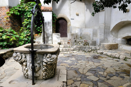 BRAN, TRANSYLVANIA, ROMANIA - around July 2018: The stone well in the courtyard in famous Dracula's Castleのeditorial素材
