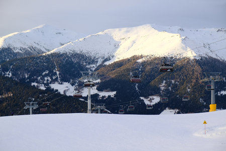 Monte Elmo, Dolomites - circa February 2020: Ski lift at the top of Monte Elmo / Helm in the evening. Dolomites, Italy, Puster Valley / Alta Pusteria, South Tyrol.のeditorial素材