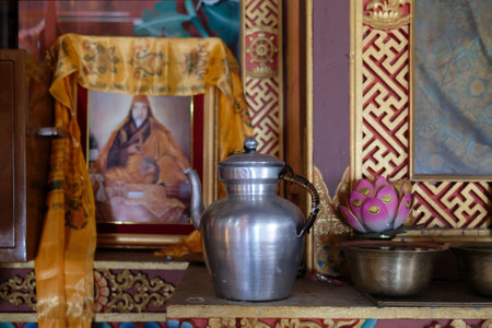 Upper Pisang, Nepal - circa November 2019: Buddhist metal utensils and lotus flower at the Gompa Monastery in Upper Pisang, Himalaya, Nepal. During trekking around Annapurna, Annapurna Circuitのeditorial素材