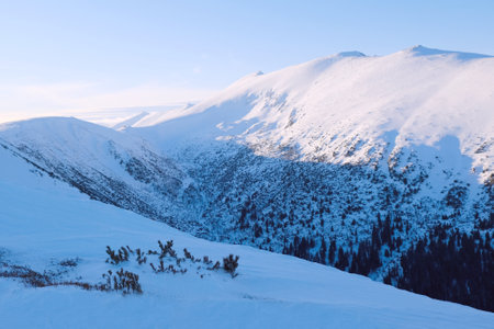 Beautiful mountain winter view during a snowshoe trip from Certovica to Dumbier - the highest peak of the Low Tatras in Slovakiaの写真素材