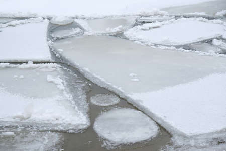Close up of a cracked ice floe in the sea