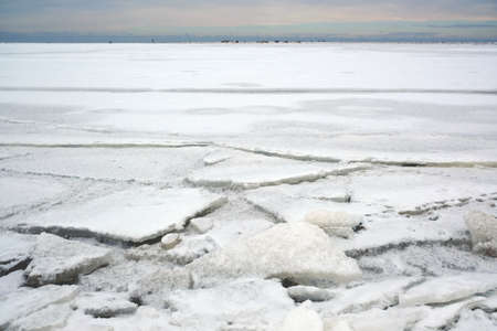 Winter seaside landscape - beach and frozen Baltic Sea near Mikoszewo, Zulawy Wislane, Poland