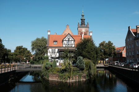 Gdansk, Poland - circa July 2020: Miller's House and the Church of Saint Catherine in Old Town on...