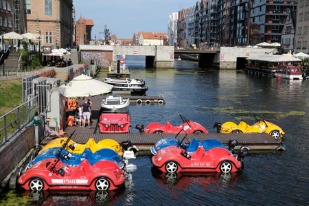 GDANSK, POLAND - around Jule 2020: Colorful water bikes in the shape of cars on the Motlawa River in...
