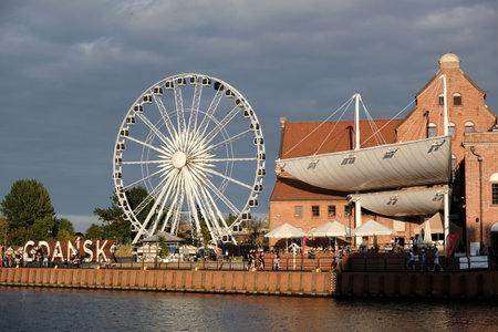 Gdansk, Poland - circa July 2020: Olowianka Island with the building of the Baltic Philharmonic and the viewing wheel on a sunny summer day. Gdansk, Polandのeditorial素材