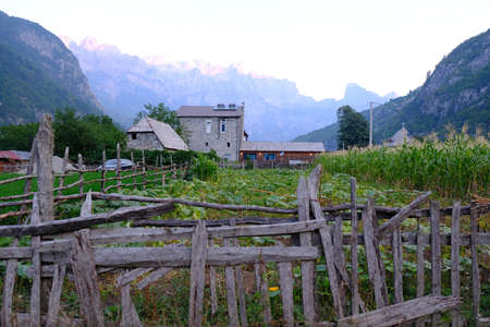 Scenery of famous mountain village Theth in Theth Valley, on background the mountains of Albanian Alpsの写真素材