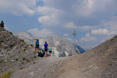 Valbona Pass (Albanian: Qafa e Valbones), Albania - circa August 2021: Three woman standing on pass, during trekking from Theth Valley to Valbona Valley in Albanian Alps.のeditorial素材