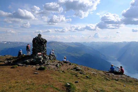 Priest RÃ¸yrgrind, Norway - circa July 2021: People on top Priest RÃ¸yrgrind. There is amazing...