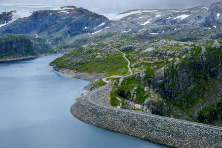 Mountain scenery during trekking to Dravladalsdammen peak, with view of Folgefonna glacier and beautiful lake districts. Jondal, Norwayの写真素材