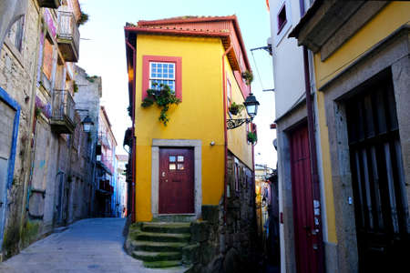Beautiful narrow street with traditional buildings in Porto, Portugal