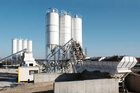 Scenery of concrete factory with white silos for production of concreteの写真素材