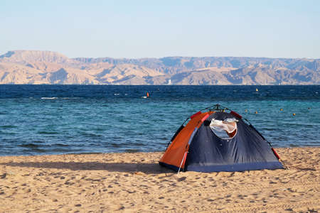 Single tent on beach by Red Sea around Aqaba, Jordanの写真素材