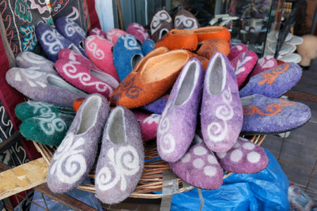 Stand of traditional felt slippers in Osh Bazaar, central market in Bishkek, Kyrgyzstan. Felt is a national product in Kyrgyzstan.の写真素材