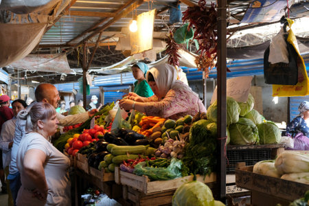 BISHKEK, KYRGYZSTAN - circa July 2021: Stands of vegetables in Osh Bazaar, central market in Bishkek, Kyrgyzstan.のeditorial素材