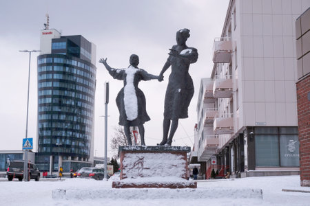 Narvik, Norway - circa February 2023 - Sculpture of women on street on main street in Narvik.のeditorial素材