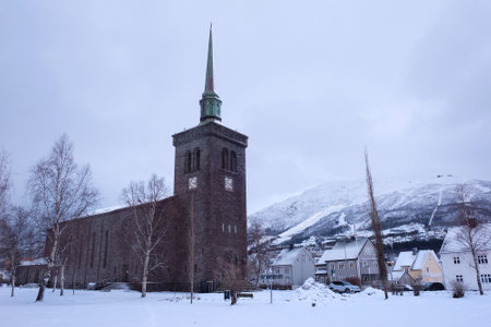 The Norwegian port city of Narvik with ancient church in winter sceneryの写真素材