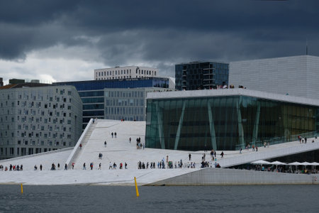 Norway, Oslo - July 25, 2023: View on a side of the National Oslo Opera House. Symbol of capital city in summer sunny and cloudy sceneryのeditorial素材