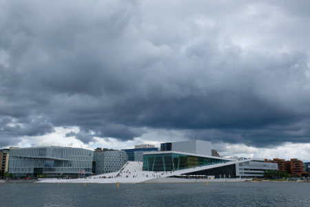 Norway, Oslo - July 25, 2023: View on a side of the National Oslo Opera House. Symbol of capital city in summer sunny and cloudy sceneryのeditorial素材