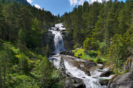 High waterfall around Hotel Pont d'Espagne on trail from Cauterets to lake Lac de Gaube. Pyrenees National Park, France.の写真素材
