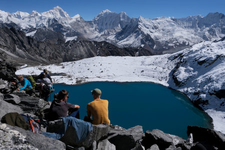 Himalayas, Nepal - October 30, 2024: Kongma La Pass 5535 m with silhouettes of trekkers. Amazing views on trekking from Dingboche through the pass. Everest Base Camp trek. Himalayasのeditorial素材