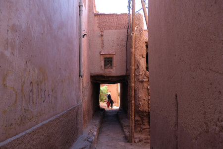 Ait Ben Ali, Morocco: Traditional berber buildings in Ait Ben Ali city and silhouettes of people on street. Dades Gorge, Tamellalt, Atlas mountains, Moroccoの写真素材