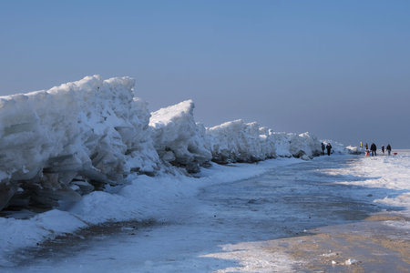 Ice toros (mountains of piled-up ice) on the beach in Mikoszewo, Baltic Sea, Pomerania, Poland. This...