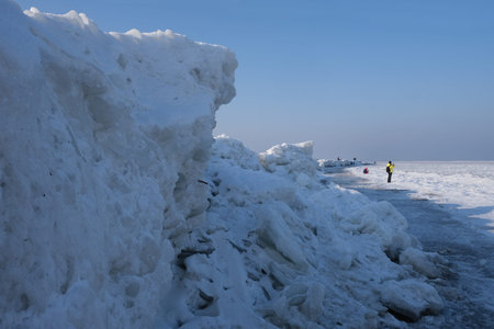Ice toros (mountains of piled-up ice) on the beach in Mikoszewo, Baltic Sea, Pomerania, Poland. This...