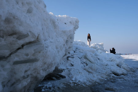 Ice toros (mountains of piled-up ice) on the beach in Mikoszewo, Baltic Sea, Pomerania, Poland. This...
