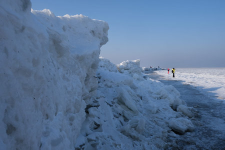 Ice toros (mountains of piled-up ice) on the beach in Mikoszewo, Baltic Sea, Pomerania, Poland. This...