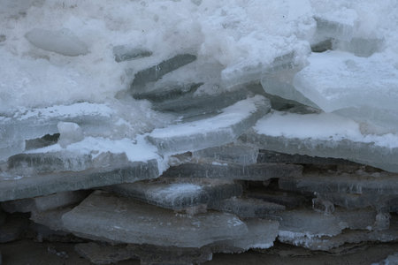 Ice toros (mountains of piled-up ice) on the beach in Mikoszewo, Baltic Sea, Pomerania, Poland. This...