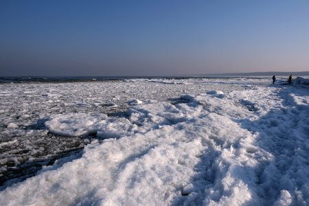 Shuga Shuga - ice floe in shape of discs in Baltic Sea on the beach in Mikoszewo, Poland