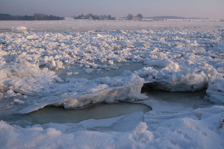 Amazing scenery of frozen Vistula river with shuga - ice floe in shape of discs. An interesting...