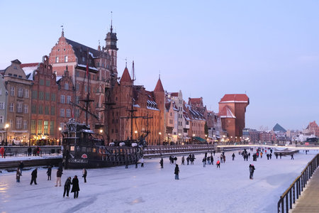 Gdansk, Poland - January 2, 2026: Frozen Motlawa River in Old City of Gdansk in evening scenery and...
