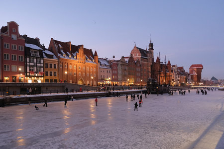 Gdansk, Poland - January 2, 2026: Frozen Motlawa River in Old City of Gdansk in evening scenery and...