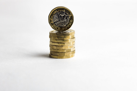 One pound coins on white backgroundの写真素材