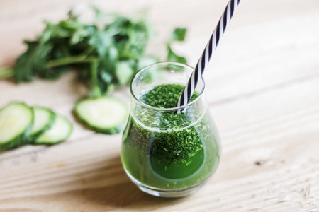 Healthy green detox juice with parsley, cucumber and wild rocketの写真素材