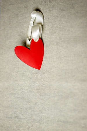 Red heart with a ribbon. Valentine's Day cardの写真素材