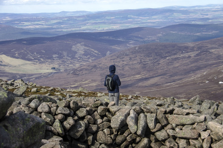 Hiker on the top of Mount Keen. Angus, Aberdeenshire, Scotland, UKのeditorial素材