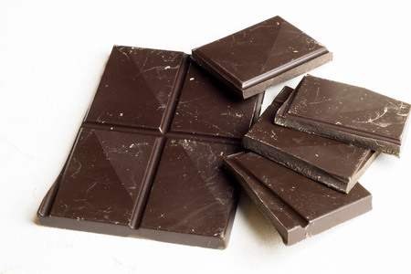Dark chocolate bar on a white backgroundの写真素材