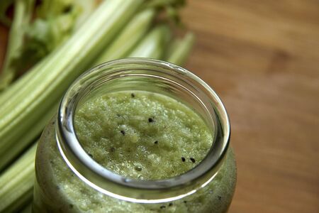 Fresh, healthy homemade green detox juice from celery sticks and kiwi. Healthy eaating concept.の写真素材