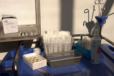 Covid-19 vaccine "comirnaty". Medical equipment on a tray.のeditorial素材