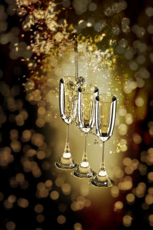 New Year background with champagne glasses and firework display on black background. Happy New Year.の写真素材