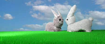 Easter background. Two rabbits in the meadow. 3D render illustration.の写真素材