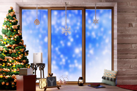Christmas winter window with falling snow outsideの写真素材
