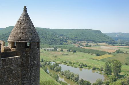 Dordogne river from the fortress of Chateau de Beynac, with part of the tower in the foreground. Horizontal compositionの写真素材